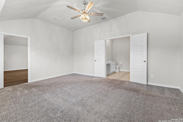 6910 Emerald Vly, San Antonio, TX 78242 - unfurnished bedroom featuring vaulted ceiling, light colored carpet, ensuite bath, a ceiling fan, and baseboards