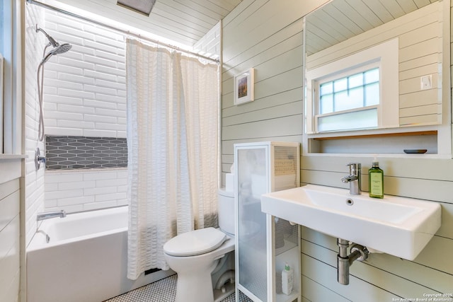 1007AND1013 Fulton, San Antonio, TX 78201 - bathroom featuring toilet, shower / tub combo, wooden walls, and a sink