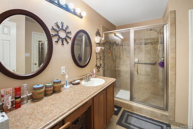 9519 Braun Shr, San Antonio, TX 78250 - full bath featuring a shower stall, vanity, and tile patterned floors
