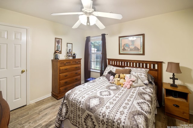 9519 Braun Shr, San Antonio, TX 78250 - bedroom with light wood-style flooring, baseboards, and ceiling fan
