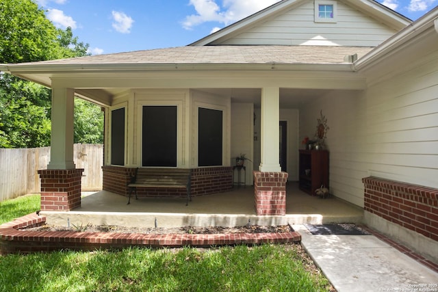 9519 Braun Shr, San Antonio, TX 78250 - view of exterior entry featuring brick siding and a shingled roof