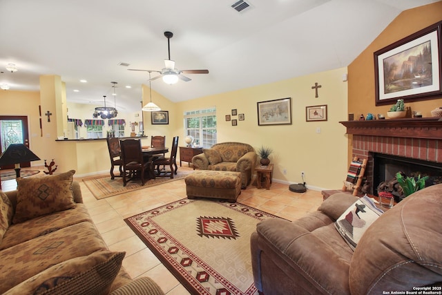 9519 Braun Shr, San Antonio, TX 78250 - living room with vaulted ceiling, ceiling fan, light tile patterned floors, a fireplace, and baseboards