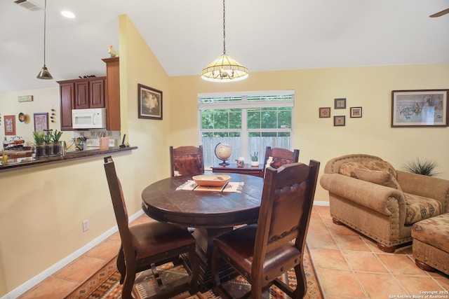 9519 Braun Shr, San Antonio, TX 78250 - dining room featuring lofted ceiling, light tile patterned floors, baseboards, and recessed lighting