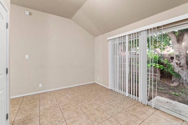 7238 Sunny Day, San Antonio, TX 78240 - unfurnished room with lofted ceiling, light tile patterned floors, and baseboards