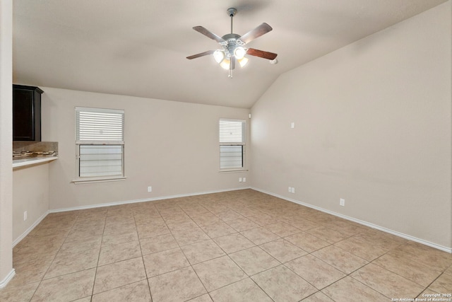 7238 Sunny Day, San Antonio, TX 78240 - empty room with a ceiling fan, lofted ceiling, light tile patterned floors, and baseboards