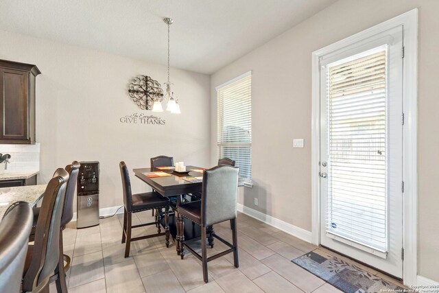 27418 Camellia Trce, Boerne, TX 78015 - dining room with a chandelier and baseboards