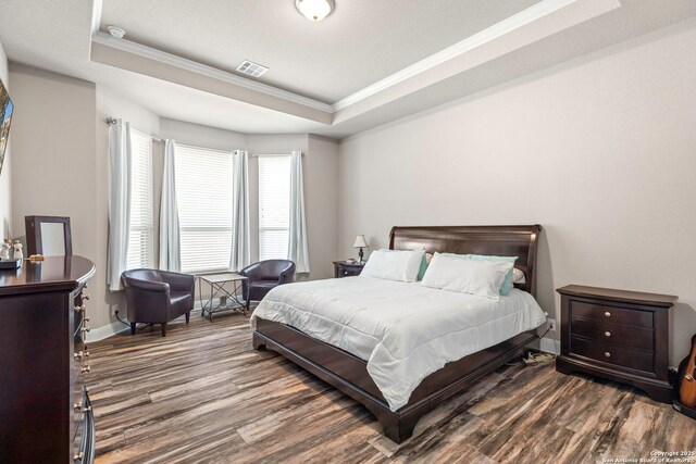 27418 Camellia Trce, Boerne, TX 78015 - bedroom with crown molding, wood finished floors, and a tray ceiling
