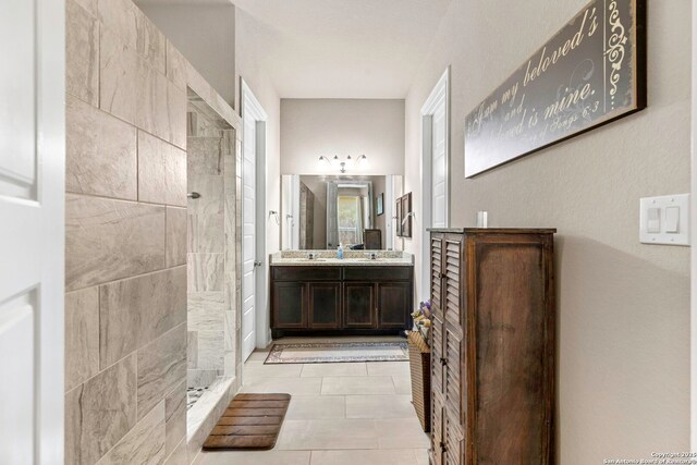 27418 Camellia Trce, Boerne, TX 78015 - bathroom featuring a walk in shower, vanity, and tile patterned flooring