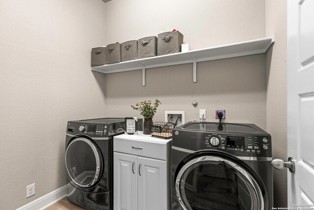 27418 Camellia Trce, Boerne, TX 78015 - washroom featuring washer hookup, electric dryer hookup, cabinet space, and tile patterned floors