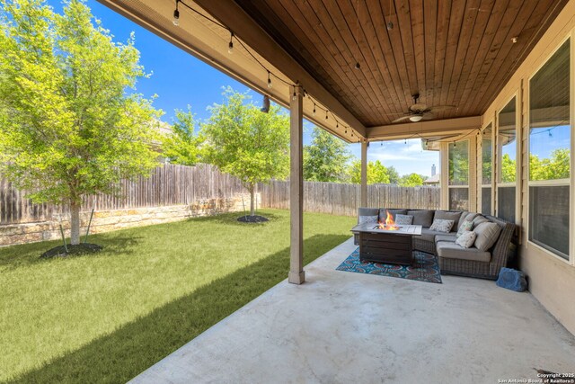 27418 Camellia Trce, Boerne, TX 78015 - fenced backyard featuring an outdoor fire pit, a patio, and a ceiling fan