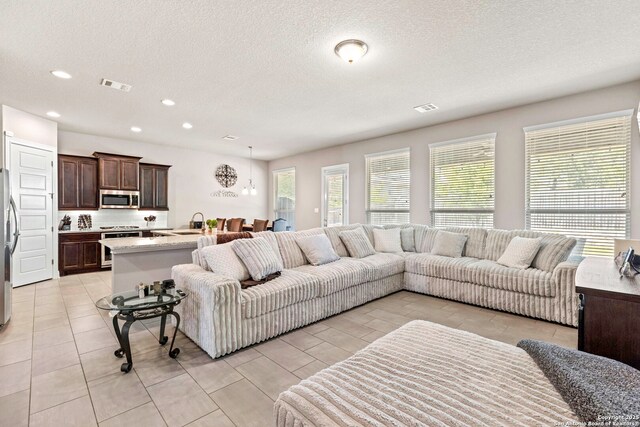 27418 Camellia Trce, Boerne, TX 78015 - living area with a textured ceiling and recessed lighting
