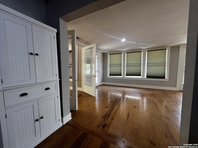 1024 W Mistletoe, San Antonio, TX 78201 - hall with baseboards and wood finished floors