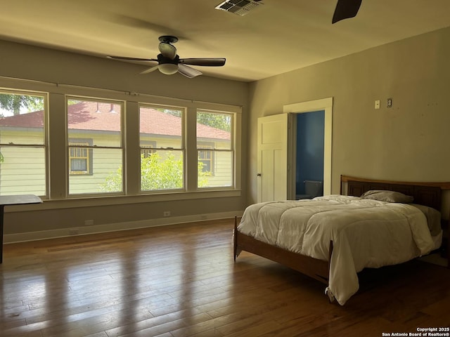 1024 W Mistletoe, San Antonio, TX 78201 - bedroom featuring hardwood / wood-style flooring, baseboards, and ceiling fan
