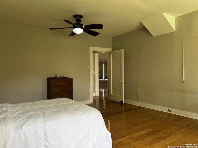 1024 W Mistletoe, San Antonio, TX 78201 - bedroom with wood finished floors, baseboards, and a ceiling fan