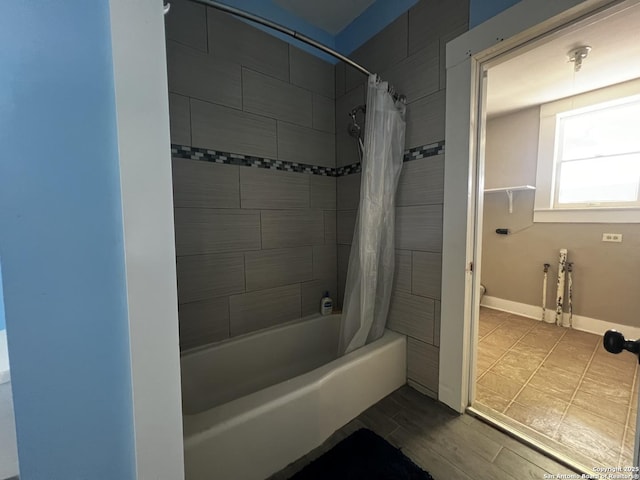 1024 W Mistletoe, San Antonio, TX 78201 - bathroom with shower / bath combo with shower curtain, baseboards, and toilet