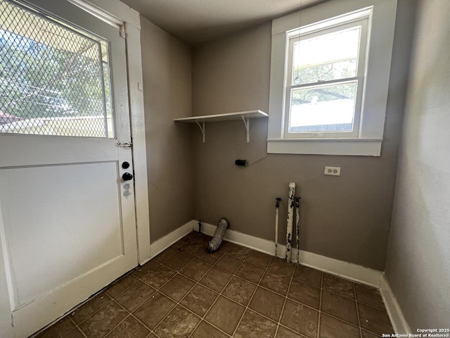 1024 W Mistletoe, San Antonio, TX 78201 - washroom with baseboards and dark tile patterned floors