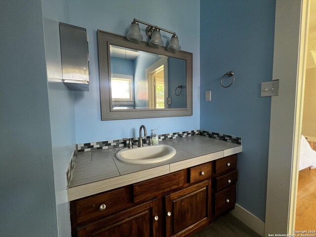 1024 W Mistletoe, San Antonio, TX 78201 - bathroom featuring vanity and baseboards