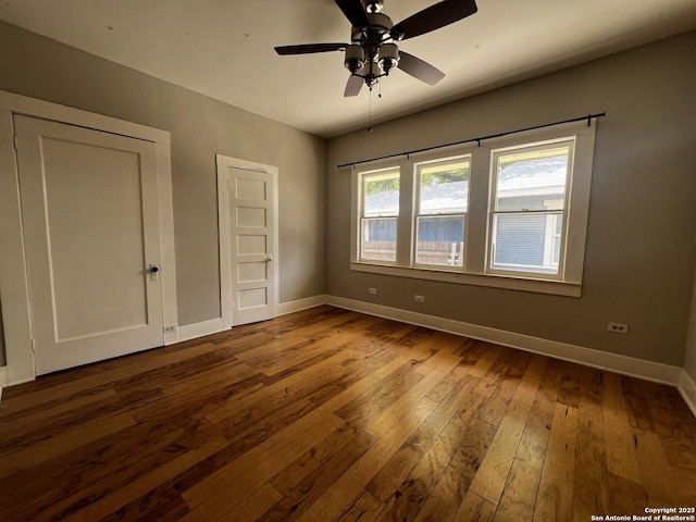 1024 W Mistletoe, San Antonio, TX 78201 - unfurnished bedroom with baseboards, hardwood / wood-style flooring, and ceiling fan
