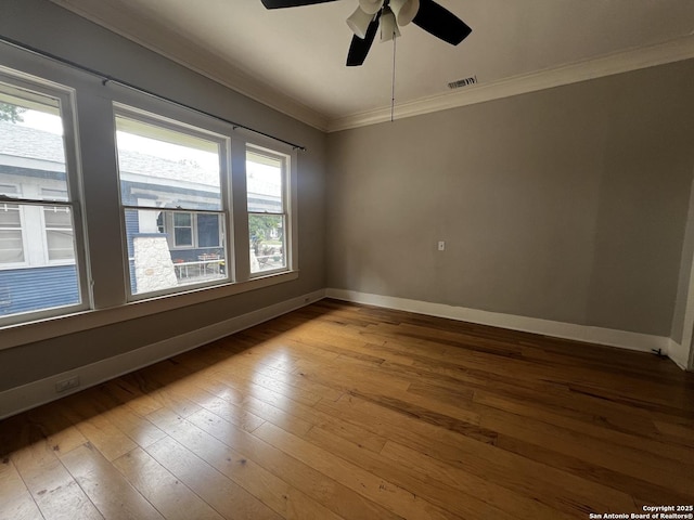 1024 W Mistletoe, San Antonio, TX 78201 - unfurnished room with crown molding, baseboards, a ceiling fan, and hardwood / wood-style floors