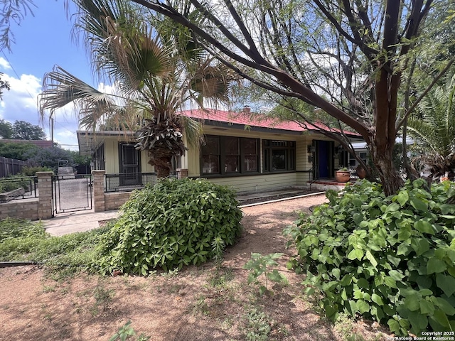 1024 W Mistletoe, San Antonio, TX 78201 - rear view of property featuring a gate