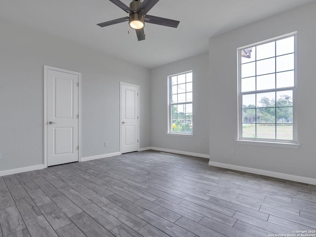 14329 Wisdom, Atascosa, TX 78002 - empty room featuring ceiling fan, wood finished floors, and baseboards