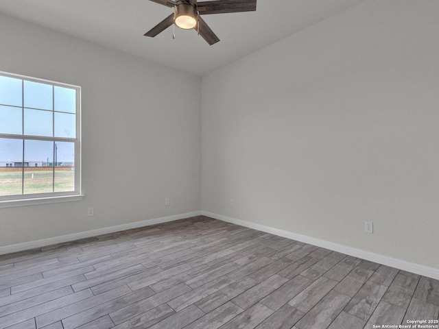 14329 Wisdom, Atascosa, TX 78002 - spare room with wood finished floors, a ceiling fan, and baseboards