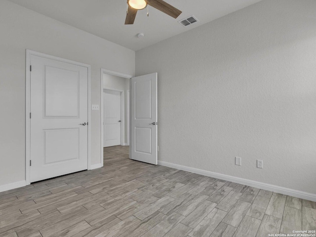 14329 Wisdom, Atascosa, TX 78002 - spare room with ceiling fan, light wood-style flooring, and baseboards