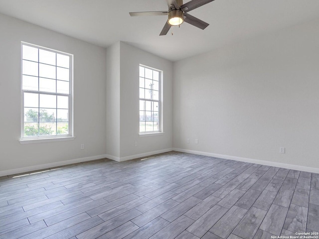 14329 Wisdom, Atascosa, TX 78002 - unfurnished room featuring wood finished floors, ceiling fan, and baseboards