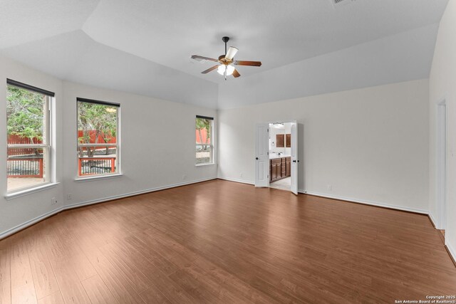 26011 Red Heron, San Antonio, TX 78261 - spare room with ceiling fan, wood finished floors, healthy amount of natural light, lofted ceiling, and baseboards
