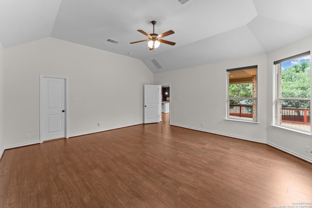 26011 Red Heron, San Antonio, TX 78261 - unfurnished room with vaulted ceiling, a ceiling fan, and wood finished floors