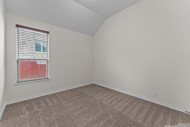 26011 Red Heron, San Antonio, TX 78261 - carpeted spare room with vaulted ceiling and baseboards