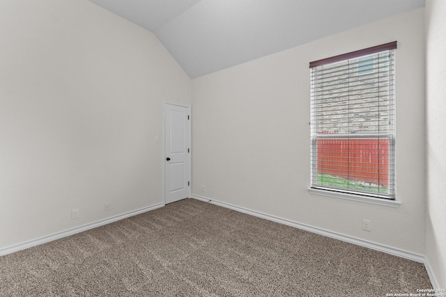 26011 Red Heron, San Antonio, TX 78261 - carpeted empty room with lofted ceiling and baseboards