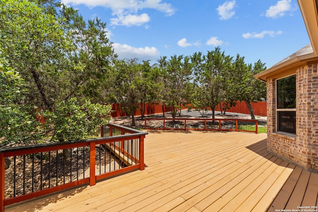 26011 Red Heron, San Antonio, TX 78261 - wooden deck with a fenced backyard