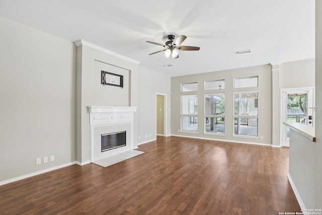 251 Las Brisas, Seguin, TX 78155 - unfurnished living room featuring a ceiling fan, healthy amount of natural light, wood finished floors, and a fireplace with flush hearth