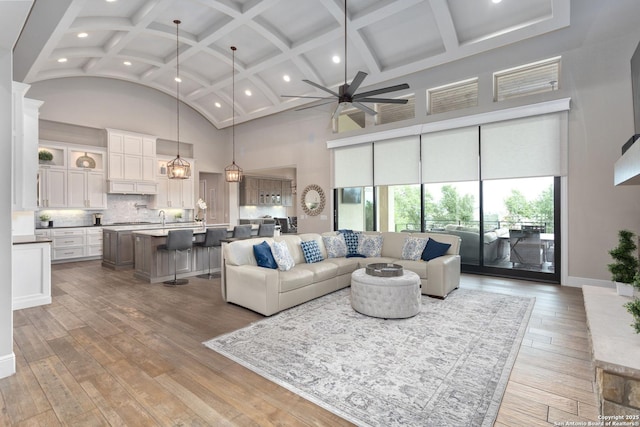 8602 Terra Mont Way, San Antonio, TX 78255 - living area featuring coffered ceiling, recessed lighting, hardwood / wood-style floors, a ceiling fan, and high vaulted ceiling