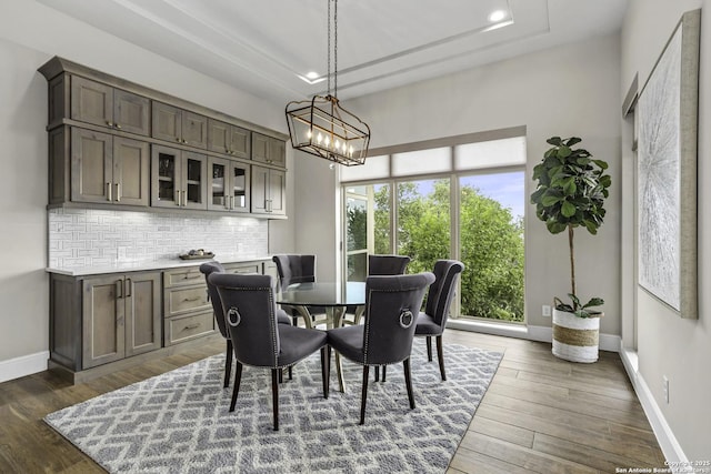 8602 Terra Mont Way, San Antonio, TX 78255 - dining room featuring baseboards, wood finished floors, recessed lighting, and a chandelier