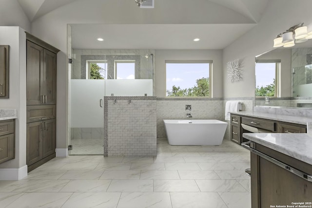 8602 Terra Mont Way, San Antonio, TX 78255 - full bathroom featuring a stall shower, a soaking tub, marble finish floors, recessed lighting, and tile walls