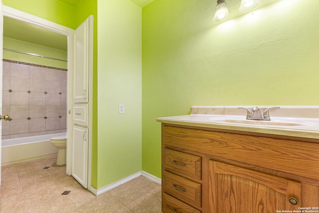 165 W Rampart Unit 204, San Antonio, TX 78216 - bathroom featuring vanity, toilet, tile patterned floors, and baseboards