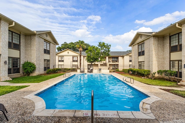 165 W Rampart Unit 204, San Antonio, TX 78216 - community pool with a residential view and a patio