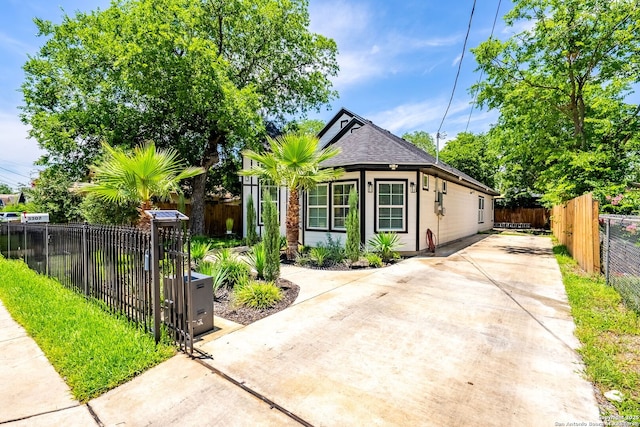 3307 W Salinas, San Antonio, TX 78207 - view of front of home with driveway and a shingled roof
