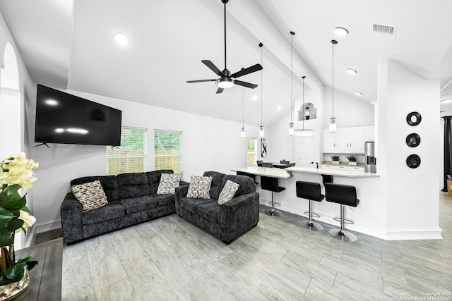 3307 W Salinas, San Antonio, TX 78207 - living area featuring ceiling fan, beamed ceiling, high vaulted ceiling, and baseboards