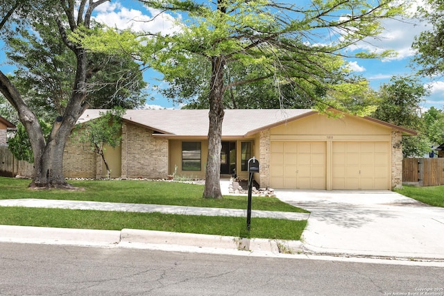 5810 Sky Country, San Antonio, TX 78247 - view of front of house featuring an attached garage, brick siding, and driveway