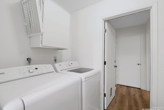5810 Sky Country, San Antonio, TX 78247 - laundry room with independent washer and dryer, cabinet space, and wood finished floors