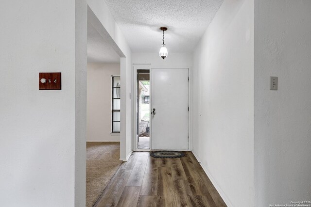 5810 Sky Country, San Antonio, TX 78247 - entrance foyer featuring wood finished floors, a textured ceiling, and baseboards