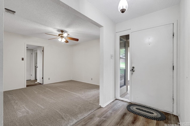 5810 Sky Country, San Antonio, TX 78247 - entrance foyer with ceiling fan, wood finished floors, a textured ceiling, and baseboards