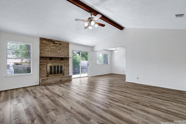 5810 Sky Country, San Antonio, TX 78247 - unfurnished living room with a textured ceiling, plenty of natural light, wood finished floors, and ceiling fan
