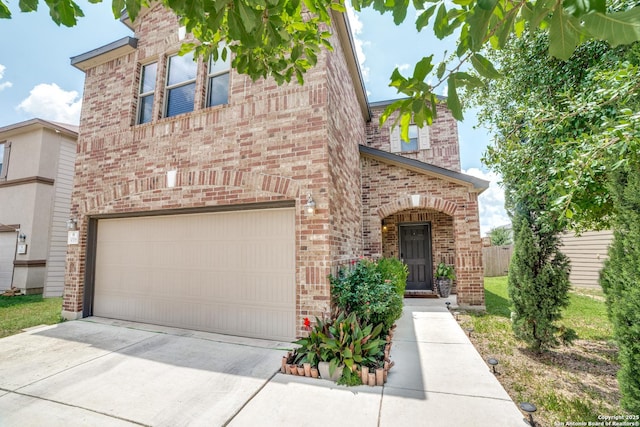 3006 Mission Bell, San Antonio, TX 78224 - view of front facade featuring brick siding, driveway, and a garage
