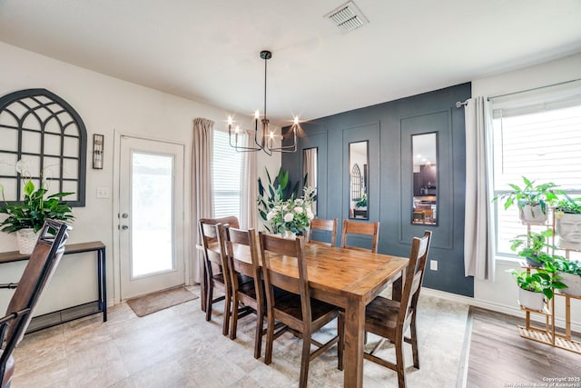 3006 Mission Bell, San Antonio, TX 78224 - dining space with healthy amount of natural light, a chandelier, and baseboards