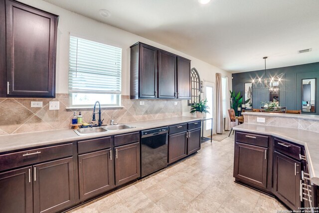 3006 Mission Bell, San Antonio, TX 78224 - kitchen featuring black dishwasher, a sink, a chandelier, backsplash, and light countertops