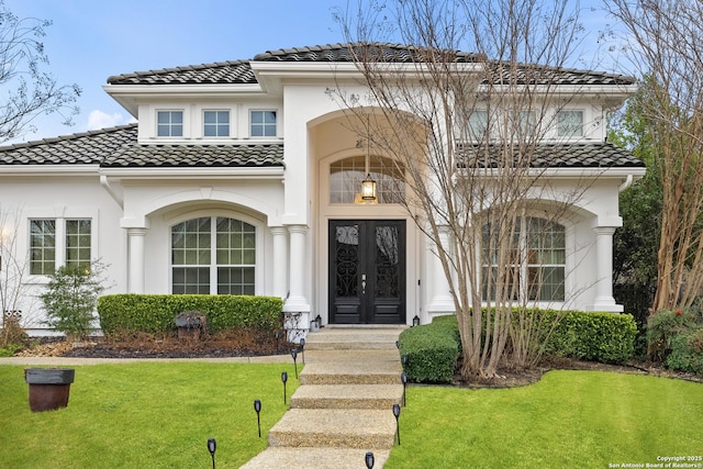 24706 Moorland, San Antonio, TX 78257 - mediterranean / spanish home featuring a tile roof, a front yard, and stucco siding